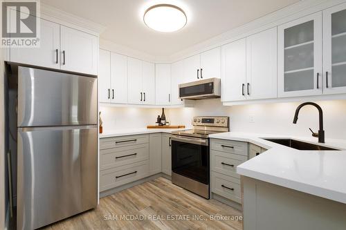 308 - 2010 Cleaver Avenue, Burlington, ON - Indoor Photo Showing Kitchen With Stainless Steel Kitchen With Upgraded Kitchen