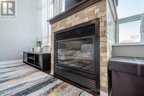 715 - 250 Manitoba Street, Toronto, ON - Indoor Photo Showing Bedroom With Fireplace