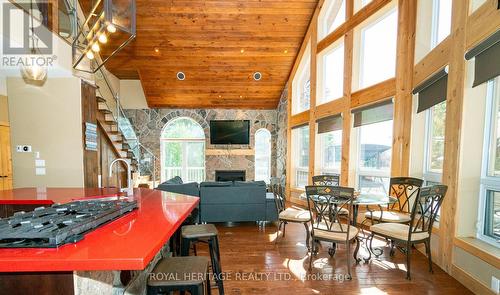 15 Lake Street, Kearney, ON - Indoor Photo Showing Other Room With Fireplace