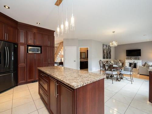 Interior - 4955 Rue Cherrier, Laval (Chomedey), QC - Indoor Photo Showing Kitchen With Fireplace