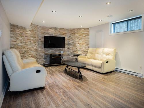 Basement - 4955 Rue Cherrier, Laval (Chomedey), QC - Indoor Photo Showing Living Room With Fireplace