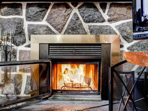 Living room - 1196 Rue De La Pisciculture, Mont-Blanc, QC - Indoor With Fireplace