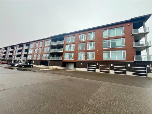 Welcome to the "Dover Wharf" located in the beach side community of Port dover - 38 Harbour Street|Unit #206, Port Dover, ON - Outdoor With Facade