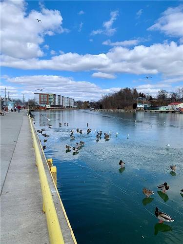 take a stroll along the boardwalk - 38 Harbour Street|Unit #206, Port Dover, ON - Outdoor With Body Of Water With View