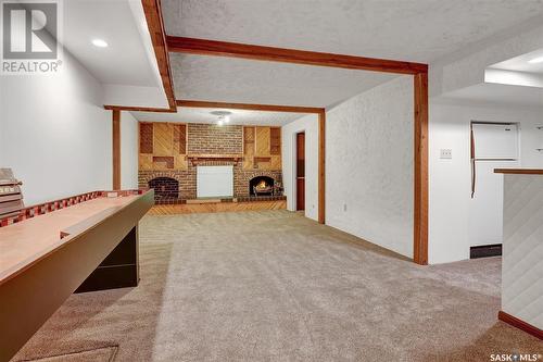 63 Ellison Crescent, Regina, SK - Indoor Photo Showing Other Room With Fireplace