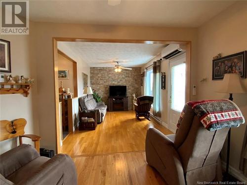 77 Bellevue Street, Edmundston, NB - Indoor Photo Showing Living Room With Fireplace