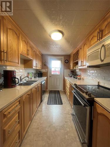 18 Lamaline Road, Fortune, NL - Indoor Photo Showing Kitchen With Double Sink