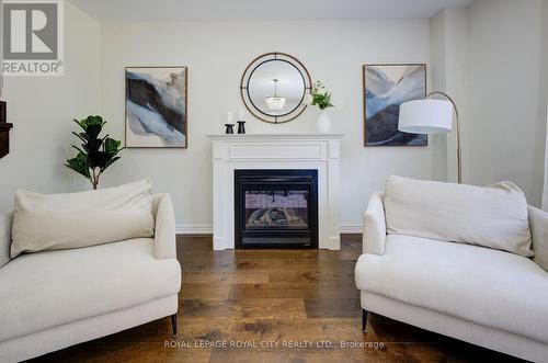 64 Harpin Way E, Centre Wellington, ON - Indoor Photo Showing Living Room With Fireplace