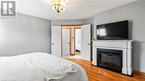 275 4Th Street Crescent, Hanover, ON - Indoor Photo Showing Bedroom With Fireplace