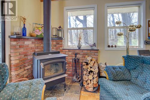 79 Tundra Lane, South Frontenac, ON - Indoor Photo Showing Living Room With Fireplace