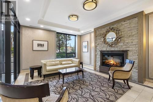 1210 - 61 Heintzman Street, Toronto, ON - Indoor Photo Showing Living Room With Fireplace