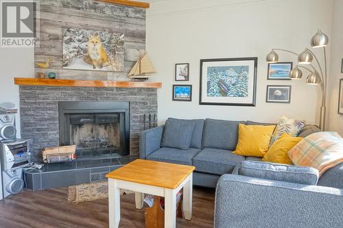 1680 Sinclair  Avenue Unit# E, Windermere, BC - Indoor Photo Showing Living Room With Fireplace