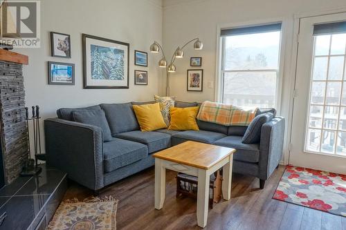 1680 Sinclair  Avenue Unit# E, Windermere, BC - Indoor Photo Showing Living Room With Fireplace