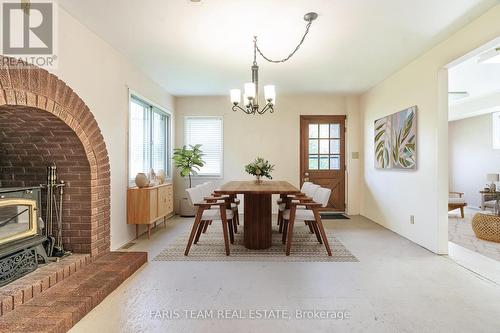 54 Hearthstone Drive, Tay, ON - Indoor Photo Showing Dining Room With Fireplace