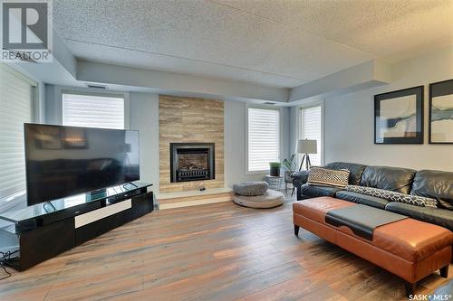 201 1002 Gryphons Walk, Regina, SK - Indoor Photo Showing Living Room With Fireplace