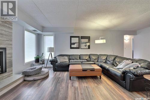 201 1002 Gryphons Walk, Regina, SK - Indoor Photo Showing Living Room With Fireplace