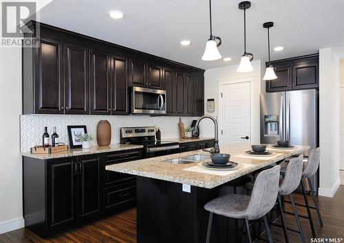 222 Schmeiser Bend, Saskatoon, SK - Indoor Photo Showing Kitchen With Stainless Steel Kitchen With Upgraded Kitchen