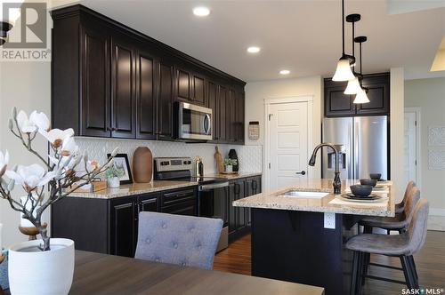 222 Schmeiser Bend, Saskatoon, SK - Indoor Photo Showing Kitchen With Stainless Steel Kitchen With Upgraded Kitchen