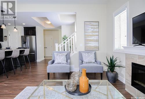 222 Schmeiser Bend, Saskatoon, SK - Indoor Photo Showing Living Room With Fireplace