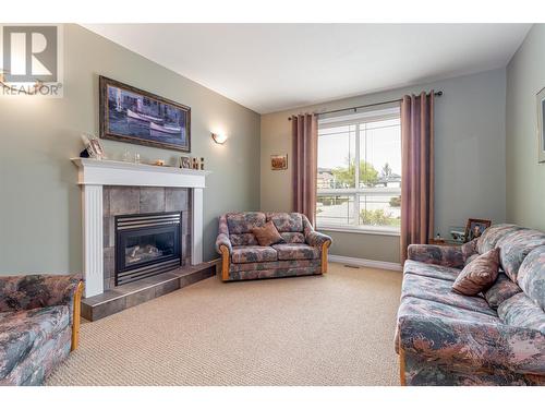 602 Spruceview Place, Kelowna, BC - Indoor Photo Showing Living Room With Fireplace