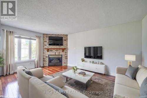 5895 Bell Harbour Drive, Mississauga, ON - Indoor Photo Showing Living Room With Fireplace