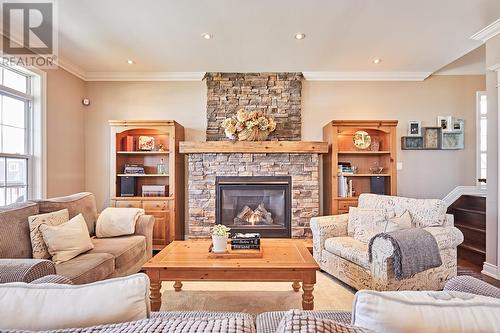 10 Queen Street, Kawartha Lakes, ON - Indoor Photo Showing Living Room With Fireplace