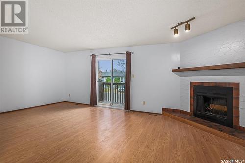 182 - 184 Verbeke Road, Saskatoon, SK - Indoor Photo Showing Living Room With Fireplace