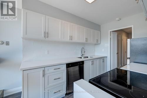 106 - 63 St Clair Avenue W, Toronto, ON - Indoor Photo Showing Kitchen With Double Sink