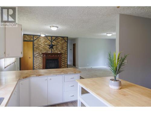 1090 Dyke Road, Mcbride, BC - Indoor Photo Showing Kitchen With Fireplace