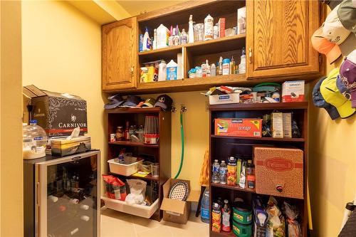 The main level pantry offers incredible storage potential. Plumbed for a main level laundry, allowing for laundry availability on both main level and lower level. - 23 Winona Park Road, Stoney Creek, ON - Indoor