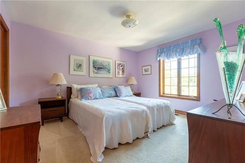 Each bedroom features full sized closets. - 23 Winona Park Road, Stoney Creek, ON - Indoor Photo Showing Bedroom