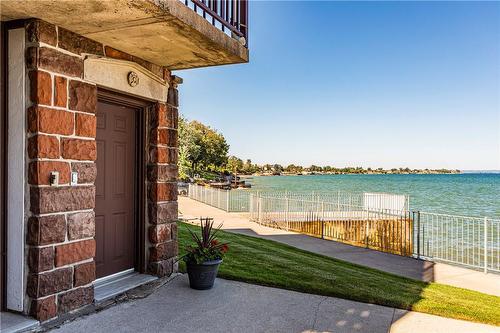 A lower level walk-out from the boathouse provides storage for lawn furniture, storing of water sports activities or store your canoes and kayaks easily. - 23 Winona Park Road, Stoney Creek, ON - Outdoor