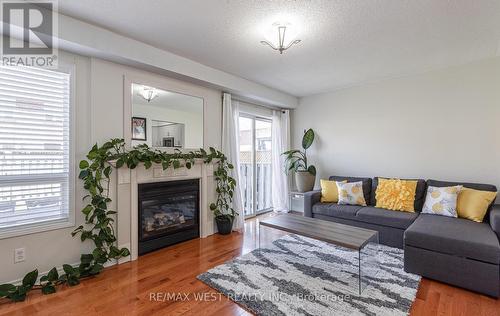 100 Lake Louise Drive, Brampton, ON - Indoor Photo Showing Living Room With Fireplace