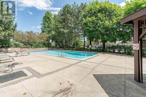210 - 10 Malta Avenue, Brampton, ON - Outdoor With In Ground Pool