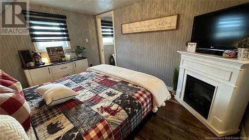 8 Ringuette Street, Sainte-Anne-De-Madawaska, NB - Indoor Photo Showing Bedroom With Fireplace