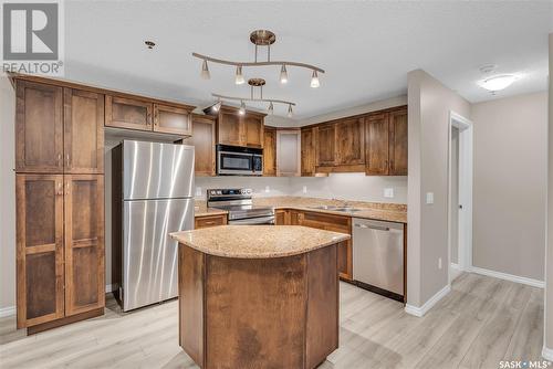 A114 103 Wellman Crescent, Saskatoon, SK - Indoor Photo Showing Kitchen With Stainless Steel Kitchen With Double Sink