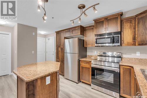 A114 103 Wellman Crescent, Saskatoon, SK - Indoor Photo Showing Kitchen With Stainless Steel Kitchen