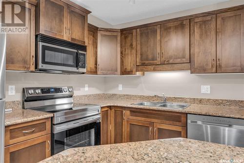 A114 103 Wellman Crescent, Saskatoon, SK - Indoor Photo Showing Kitchen With Stainless Steel Kitchen With Double Sink