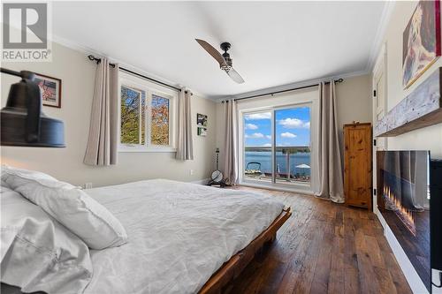 60 Pinehaven Lane, Perth Road, ON - Indoor Photo Showing Bedroom With Fireplace