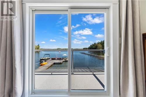 60 Pinehaven Lane, Perth Road, ON - Indoor Photo Showing Other Room With Body Of Water