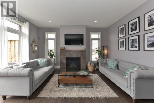 50 - 555 Sunningdale Road E, London, ON - Indoor Photo Showing Living Room With Fireplace