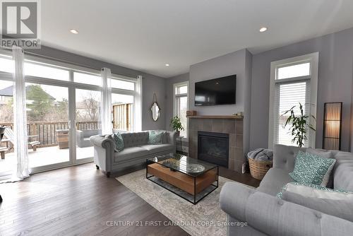 50 - 555 Sunningdale Road E, London, ON - Indoor Photo Showing Living Room With Fireplace