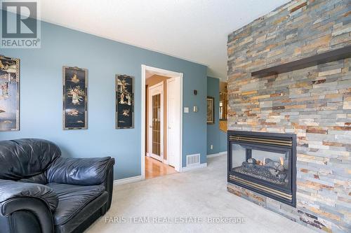 36 Marlow Circle, Springwater, ON - Indoor Photo Showing Living Room With Fireplace