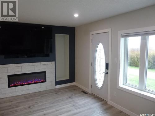 Walker Acreage, Edenwold, SK - Indoor Photo Showing Other Room With Fireplace
