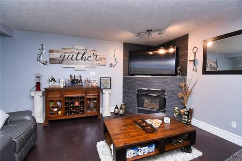 100 Stone Church Road E, Hamilton, ON - Indoor Photo Showing Living Room With Fireplace