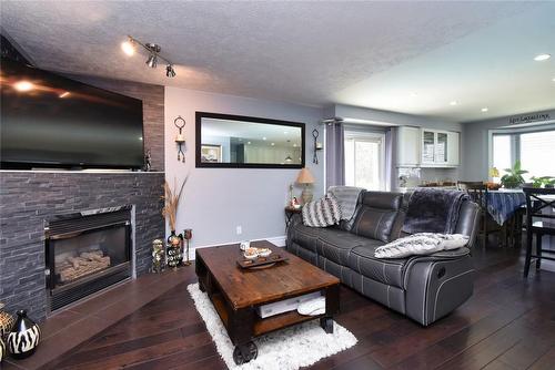 100 Stone Church Road E, Hamilton, ON - Indoor Photo Showing Living Room With Fireplace