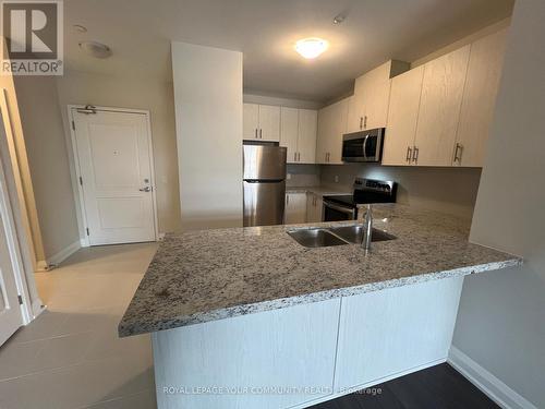 #208 -5917 Main St, Whitchurch-Stouffville, ON - Indoor Photo Showing Kitchen With Double Sink