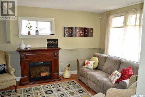 211 6Th Avenue, Kindersley, SK - Indoor Photo Showing Living Room With Fireplace