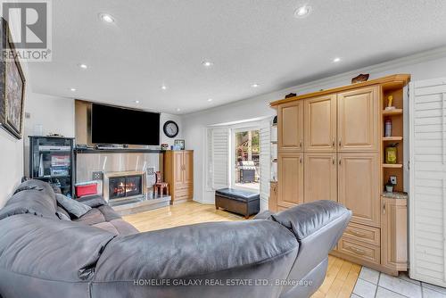14 Large Court, Brampton, ON - Indoor Photo Showing Living Room With Fireplace