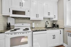 gleaming stove & cabinets - 